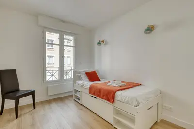 Un ou plusieurs lits dans un hébergement de l'établissement Superb Flat with Balcony - Near Notre-Dame - Paris 05