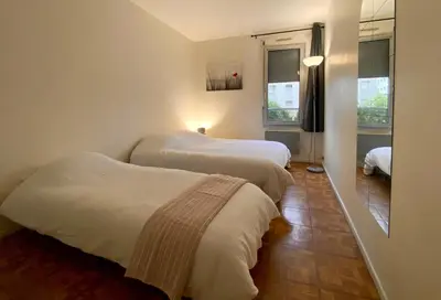Un ou plusieurs lits dans un hébergement de l'établissement Appartement spacieux Paris Vanves Parc des expositions
