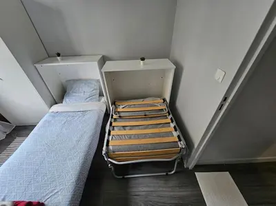 Un ou plusieurs lits dans un hébergement de l'établissement Cosy Paris Boulogne billancourt Rolland Garros PSG
