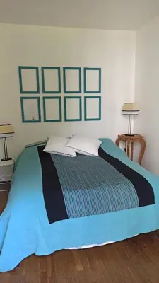 Un ou plusieurs lits dans un hébergement de l'établissement Chambres d'hôtes calmes sur jardin Paris Batignolles