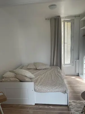 Un ou plusieurs lits dans un hébergement de l'établissement Cosy Studio - near Paris