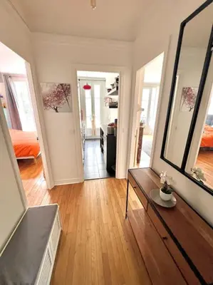 Un ou plusieurs lits dans un hébergement de l'établissement Grand appartement dans Paris 8 couchages