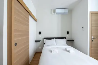 Un ou plusieurs lits dans un hébergement de l'établissement New two bedroom two bathroom apartment Paris 15 near Eiffel with air conditioning