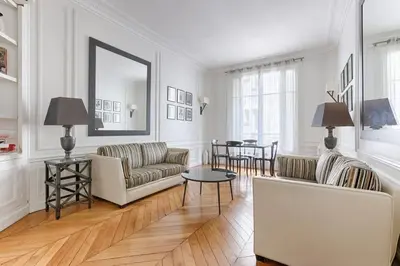 Un ou plusieurs lits dans un hébergement de l'établissement Appartement de Luxe sur les Invalides