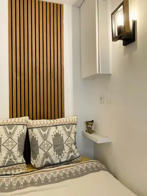 Un ou plusieurs lits dans un hébergement de l'établissement Chic studio Marais Paris centre