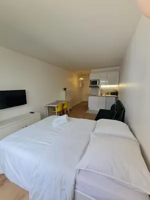 Un ou plusieurs lits dans un hébergement de l'établissement Super studio Paris La Défense