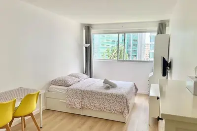 Un ou plusieurs lits dans un hébergement de l'établissement Super studio Paris La Défense