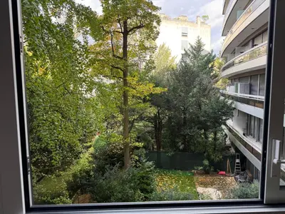 Jardin de l'établissement Charmant appartement vue jardin