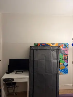 Télévision ou salle de divertissement dans l'établissement Charmant appartement vue jardin