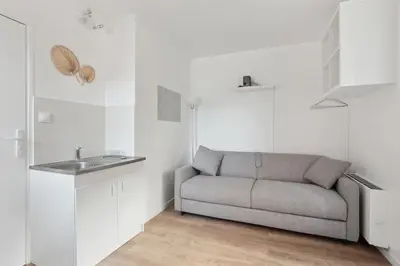 Coin salon dans l'établissement ID 412 - Cozy studio Near Eifel Tower
