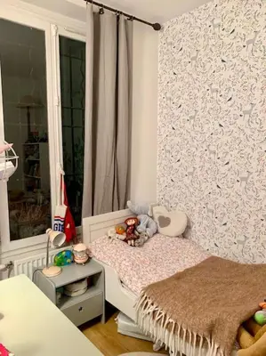 Un ou plusieurs lits dans un hébergement de l'établissement Cosy Chic Family Flat in Paris