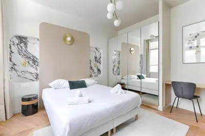 Un ou plusieurs lits dans un hébergement de l'établissement Appartement de charme 1BR Condorcet Saint-Georges