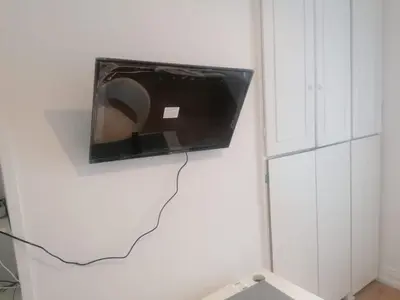 Télévision ou salle de divertissement dans l'établissement Rimk Location