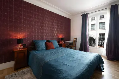 Un ou plusieurs lits dans un hébergement de l'établissement Art de Vivre - Très bel appartement à Paris