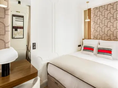 Un ou plusieurs lits dans un hébergement de l'établissement Merveil - Signature Suite - Marais - Montmartre