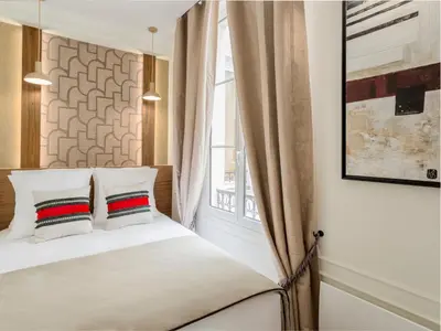 Un ou plusieurs lits dans un hébergement de l'établissement Merveil - Signature Suite - Marais - Montmartre