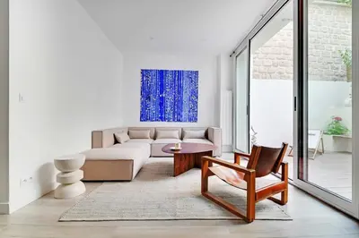 Coin salon dans l'établissement Charming apt with patio - 2BD4P - Monceau Park