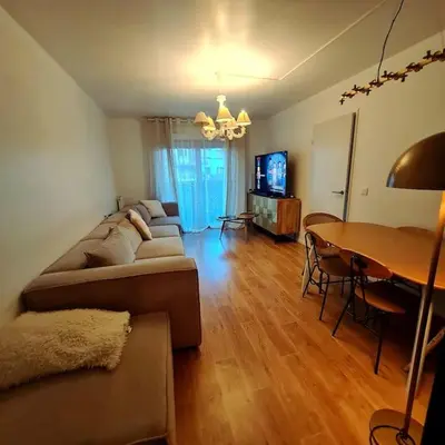 Télévision ou salle de divertissement dans l'établissement Appart Cosy Family near JO2024