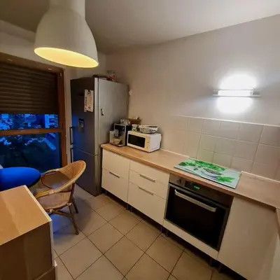 Cuisine ou kitchenette dans l'établissement Appart Cosy Family near JO2024