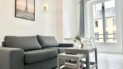 Coin salon dans l'établissement 117- Charmant Appartement Cosy pour 5 au Cœur de Paris