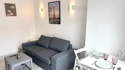 Coin salon dans l'établissement 117- Charmant Appartement Cosy pour 5 au Cœur de Paris