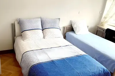 Un ou plusieurs lits dans un hébergement de l'établissement Appartement parisien et familial de 90m2
