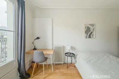 Un ou plusieurs lits dans un hébergement de l'établissement Flexliving - room - Turbigo