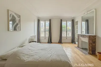 Un ou plusieurs lits dans un hébergement de l'établissement Flexliving - room - Turbigo