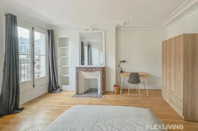 Un ou plusieurs lits dans un hébergement de l'établissement Flexliving - room - Turbigo