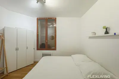 Un ou plusieurs lits dans un hébergement de l'établissement Flexliving - room - Banquier