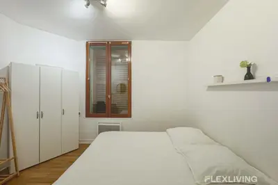 Un ou plusieurs lits dans un hébergement de l'établissement Flexliving - whole flat - Banquier
