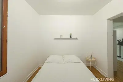 Un ou plusieurs lits dans un hébergement de l'établissement Flexliving - whole flat - Banquier