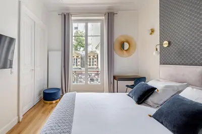 Un ou plusieurs lits dans un hébergement de l'établissement Newly renovated apt near La Madeleine