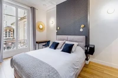 Un ou plusieurs lits dans un hébergement de l'établissement Newly renovated apt near La Madeleine