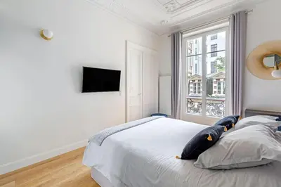 Un ou plusieurs lits dans un hébergement de l'établissement Newly renovated apt near La Madeleine