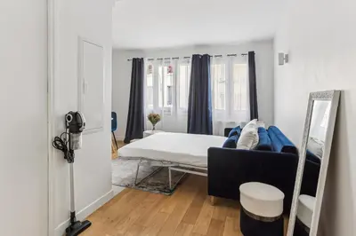 Un ou plusieurs lits dans un hébergement de l'établissement Appartement charmant proche de la Défense