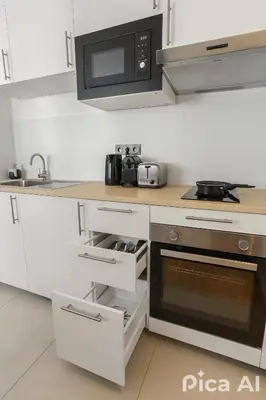 Cuisine ou kitchenette dans l'établissement Appartement charmant proche de la Défense