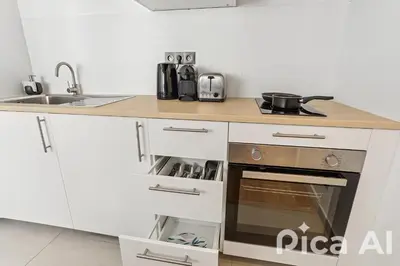Cuisine ou kitchenette dans l'établissement Appartement charmant proche de la Défense