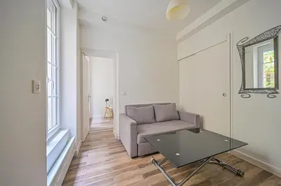 Coin salon dans l'établissement Appartement Suite Truffaut