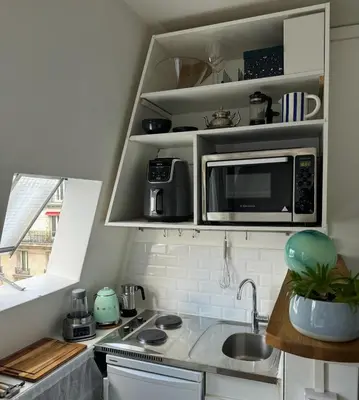 Cuisine ou kitchenette dans l'établissement Appartement cosy au cœur du Paris 17eme