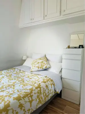 Un ou plusieurs lits dans un hébergement de l'établissement Appartement cosy au cœur du Paris 17eme