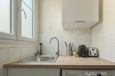Cuisine ou kitchenette dans l'établissement Flexliving - Room - Mesnil