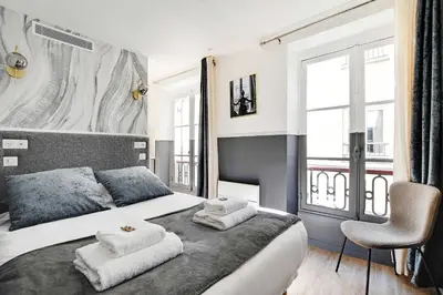 Un ou plusieurs lits dans un hébergement de l'établissement Cosy Studio for 2P with A-C - Near Montmartre