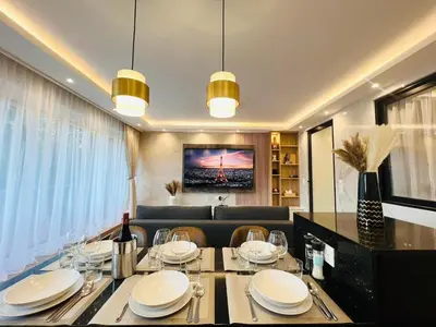 Télévision ou salle de divertissement dans l'établissement Appartement luxueux Le Bon Marché Paris 6
