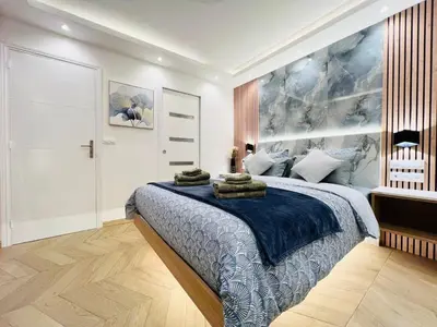Un ou plusieurs lits dans un hébergement de l'établissement Appartement luxueux Le Bon Marché Paris 6