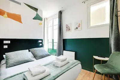 Un ou plusieurs lits dans un hébergement de l'établissement Cosy Cocoon for 2P with A-C - Near Montmartre