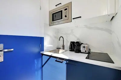 Cuisine ou kitchenette dans l'établissement Studio Cosy for 2P with A-C - Near Montmartre