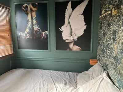 Un ou plusieurs lits dans un hébergement de l'établissement le Boudoir de Longchamp