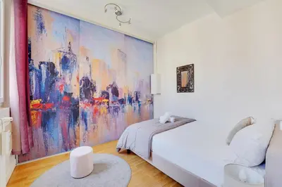 Un ou plusieurs lits dans un hébergement de l'établissement Joli 90m2 - 2 ch proche Champs-Elysees, climatise