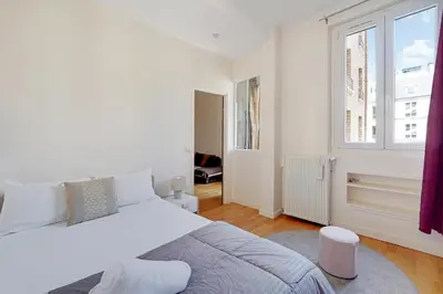 Un ou plusieurs lits dans un hébergement de l'établissement Joli 90m2 - 2 ch proche Champs-Elysees, climatise